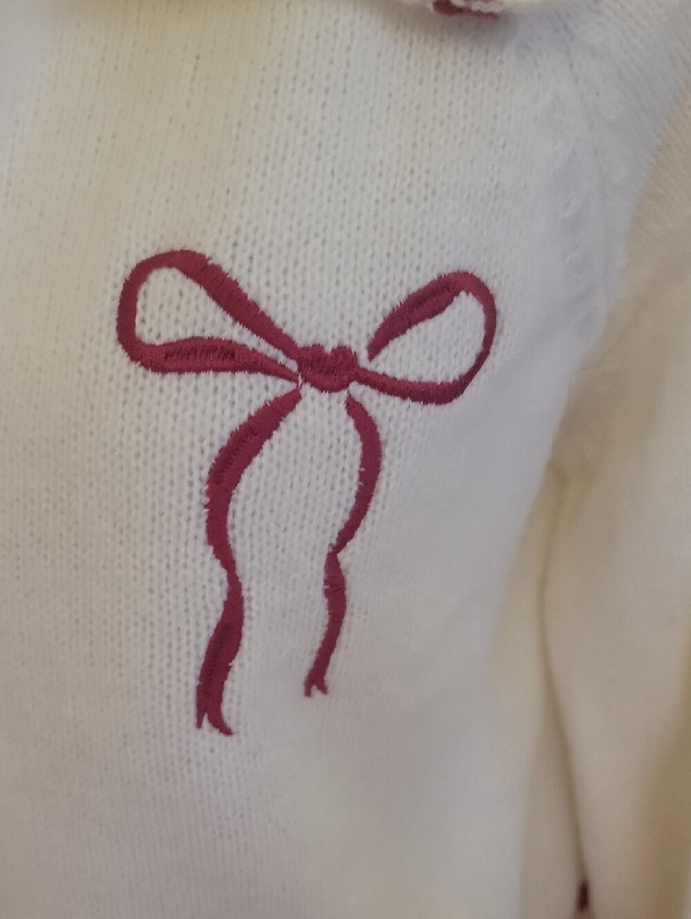 Daisy White Zip-Up Knit Bomber with Pink Bow Details - Picture 2 of 7